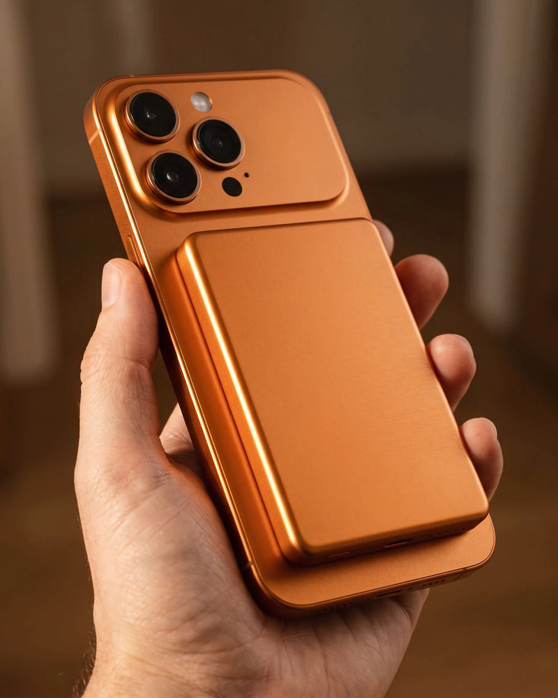 The copper finish held on the back of an orange phone