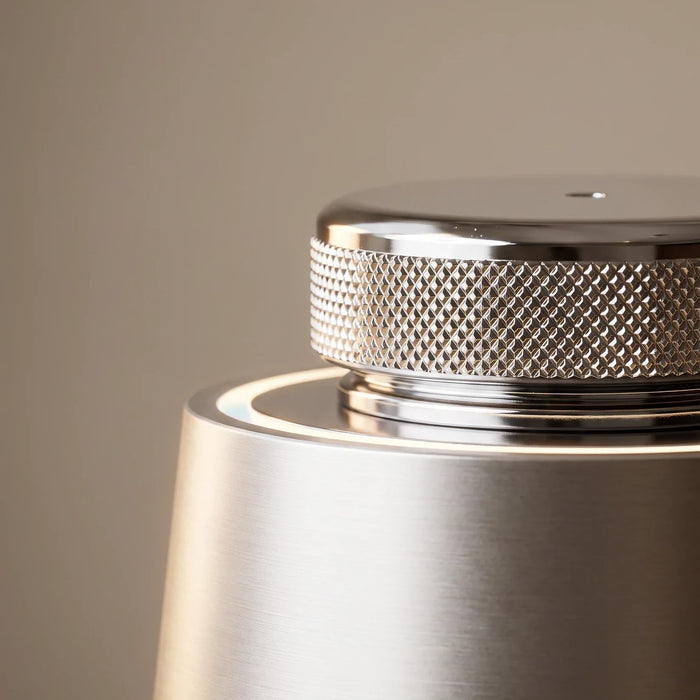 The car diffuser — the knurled chrome cap and brushed body up close