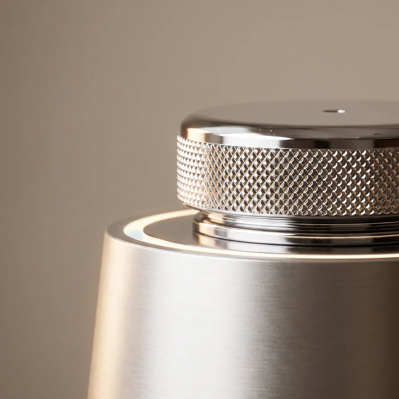 The car diffuser — the knurled chrome cap up close