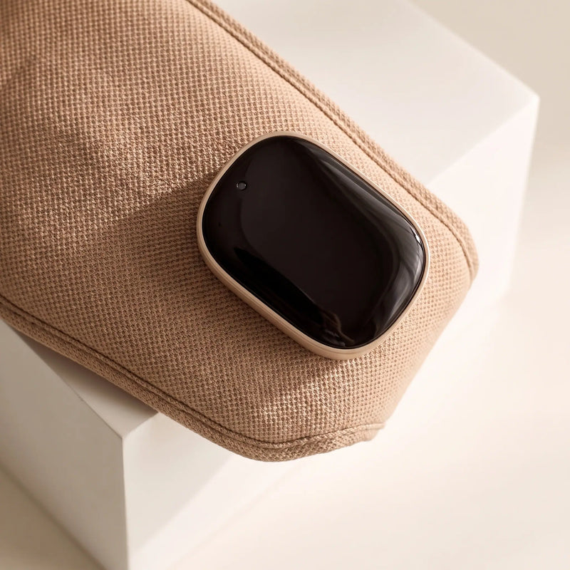 The heated eye massager — glossy charging module detail
