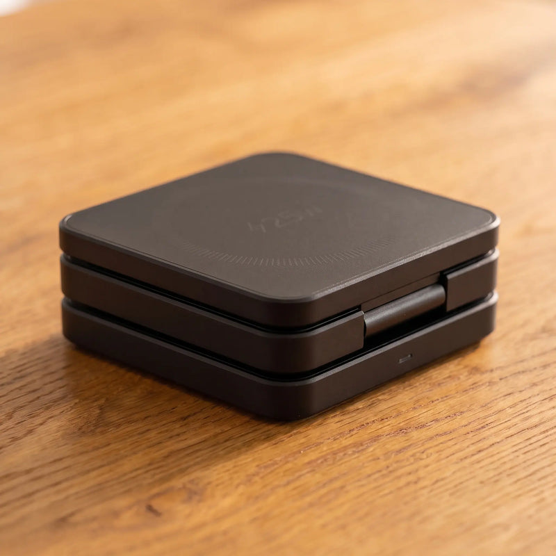 The charging stand collapsed flat into its travel shape