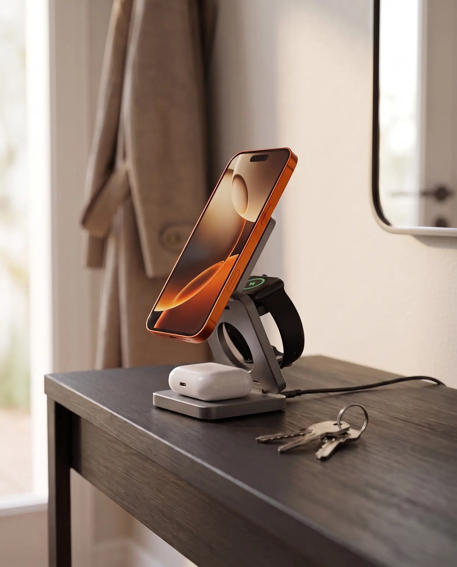 The charging stand on an entryway console table, charging cable connected