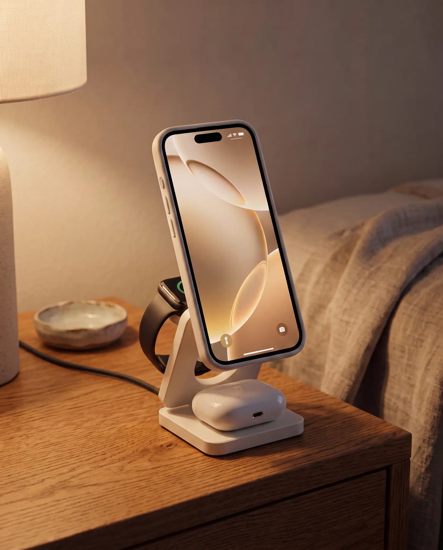 The charging stand on a warm oak nightstand at evening, charging cable connected