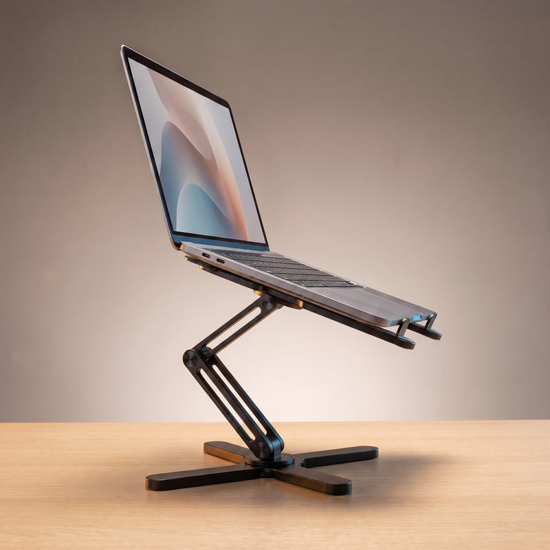 The folding laptop stand in Matte Black, holding a laptop at eye level