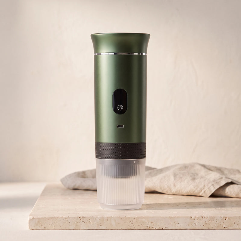 The portable espresso maker in Moss Green