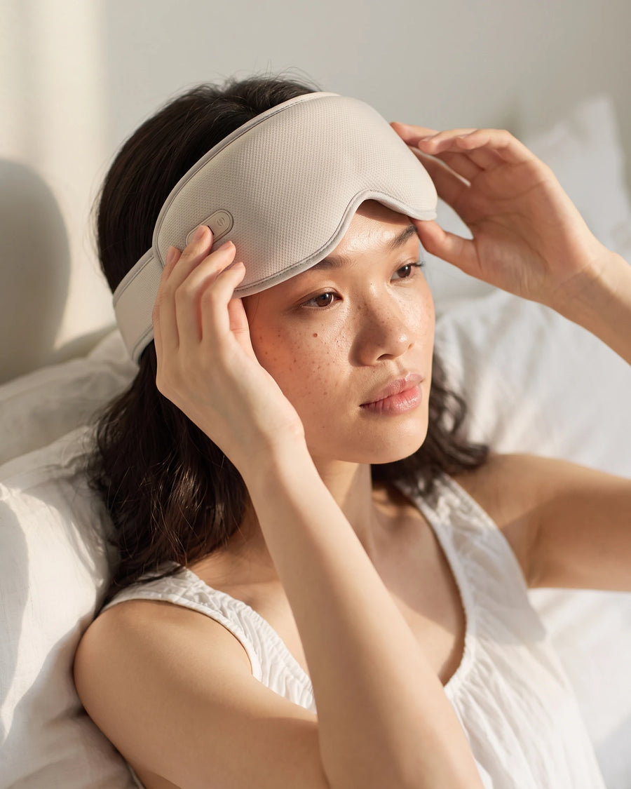 The heated eye massager pushed up onto the forehead at the end of a session