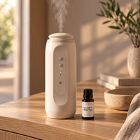 A bottle beside the Waterless Diffuser on a side table