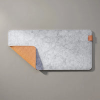 Felt & Cork Desk Mat in Ash, a corner turned back to show the cork underside