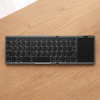 The folding keyboard in Graphite, on oak