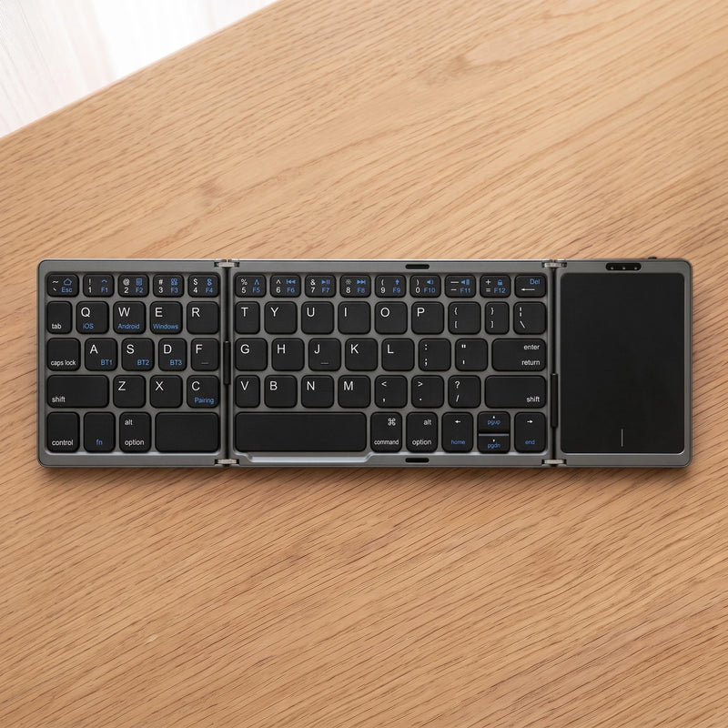 The folding keyboard in Graphite, on oak
