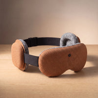 The Bluetooth sleep mask — the padded ear-cushion speakers, in Clay