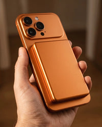 The copper finish held on the back of an orange phone