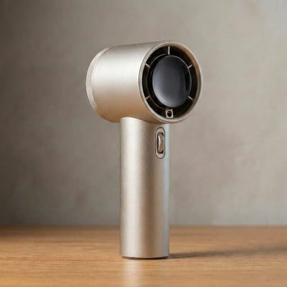 The Gust handheld turbo fan in Champagne