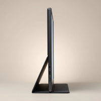 The portable monitor in profile, showing the thin panel and its stand